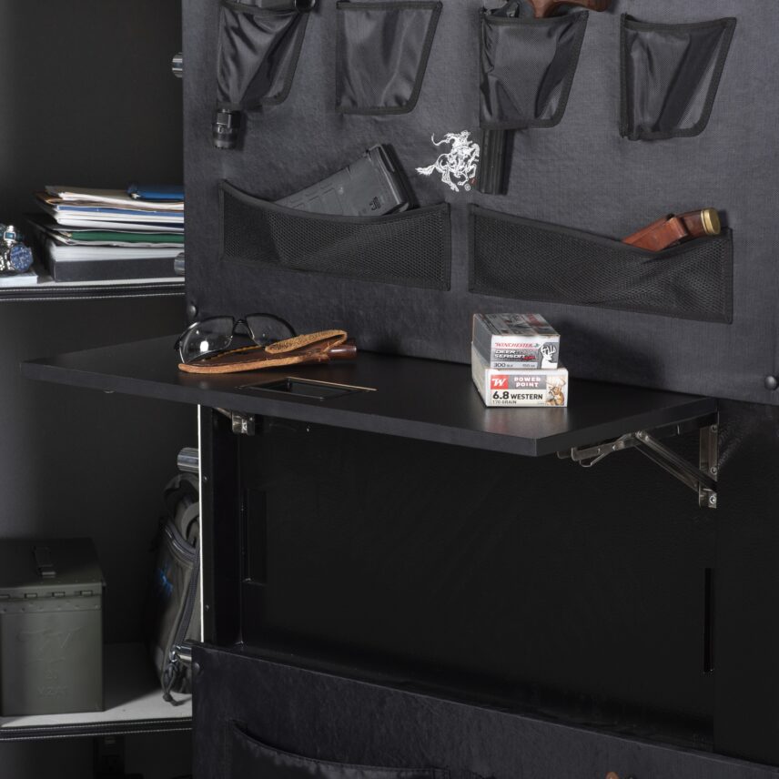 Close-up of the Winchester Big Daddy XLT retractable Utility Shelf extended with a Winchester ammo box, knife, and glasses