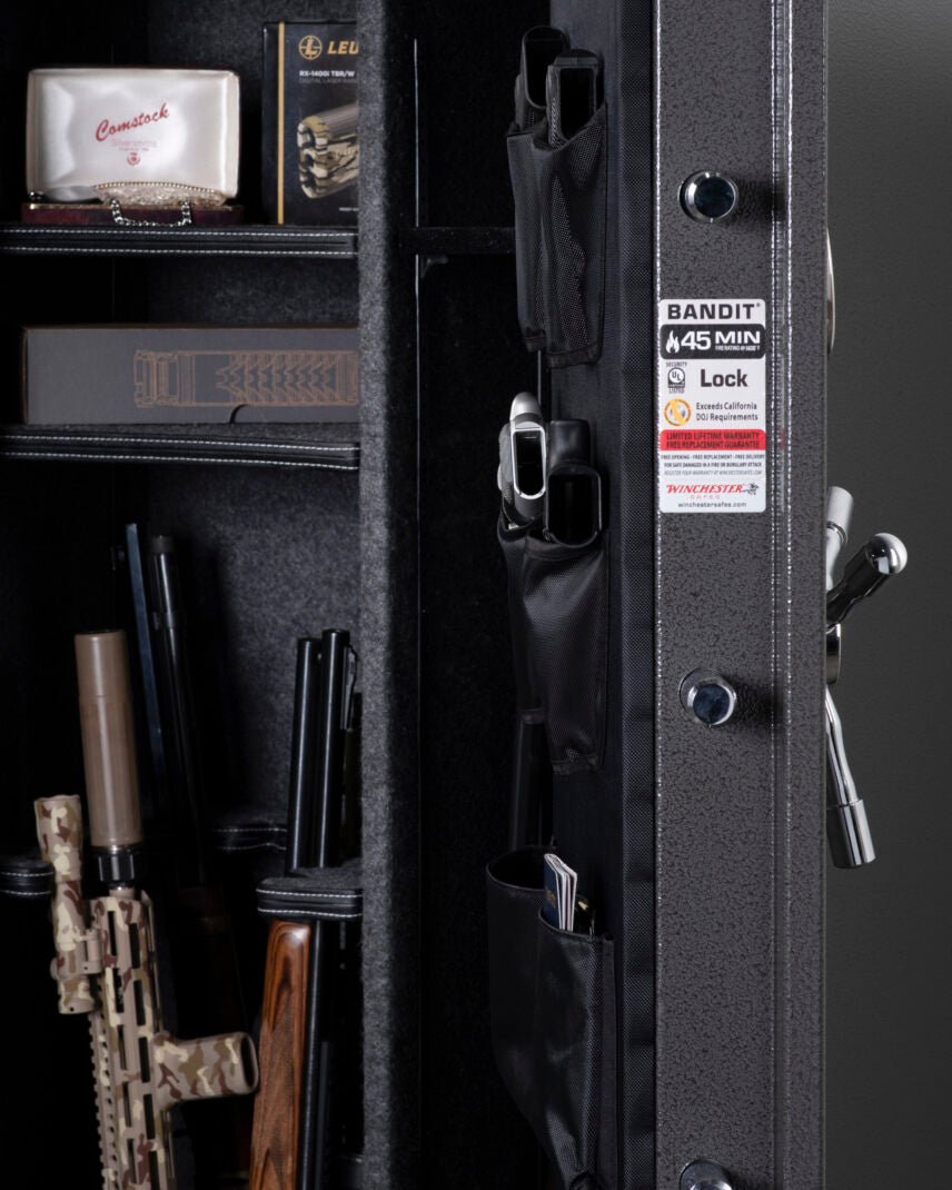 Winchester Bandit 19 detail of door panel organizer with pistol holder, zippered ammo pouch, and locking bolts visible