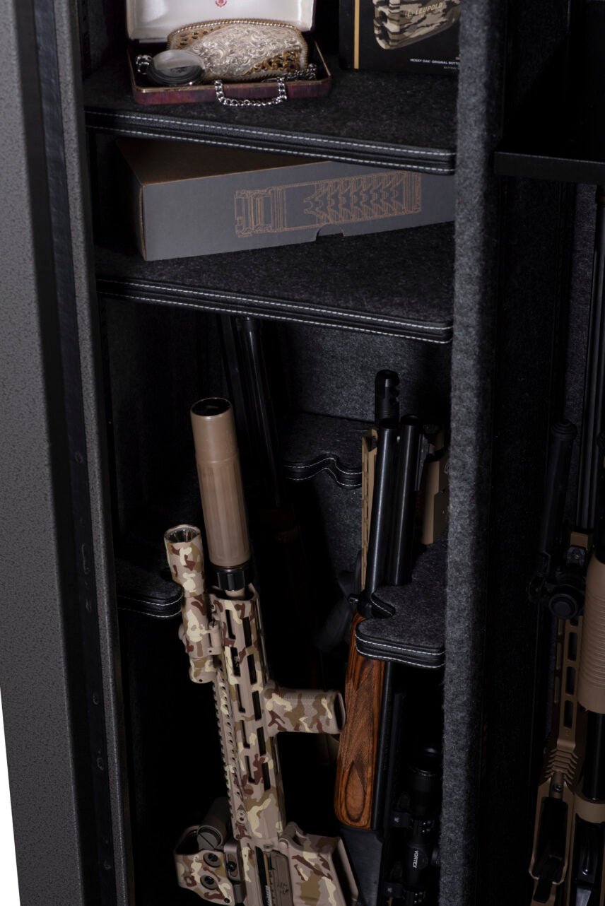 Winchester Bandit 19 interior close-up with jewelry box and ammo on top shelf plus loaded long guns in main compartment