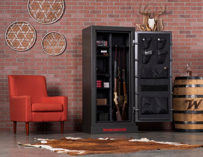 Winchester Bandit 19 open in a brick-wall den showing loaded interior with long guns, ammo shelves, and door organizer
