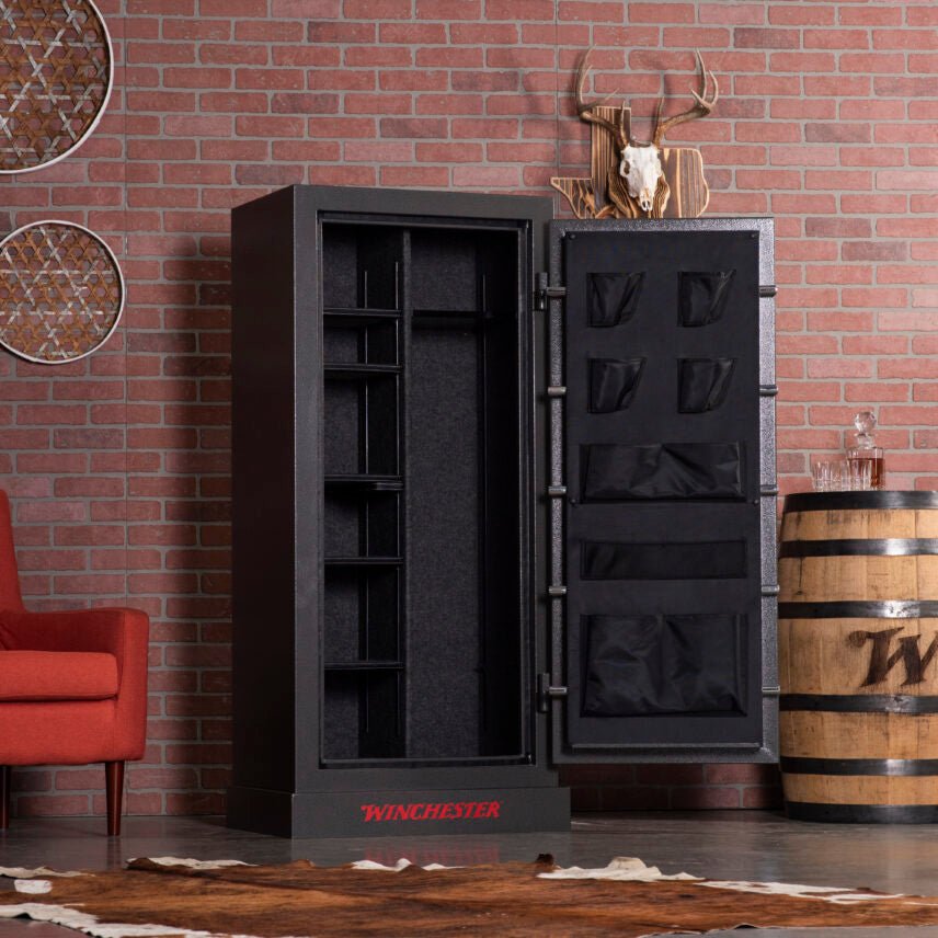 Winchester Bandit 19 open and empty in a brick-wall den showing adjustable shelving and the door panel organizer layout