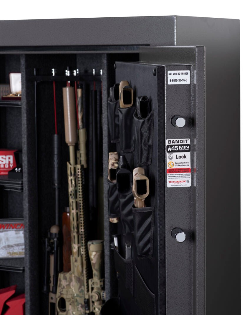 Winchester Bandit 31 angled view showing 1-inch locking bolts on open door edge, pistol door organizer, and 45-min fire label