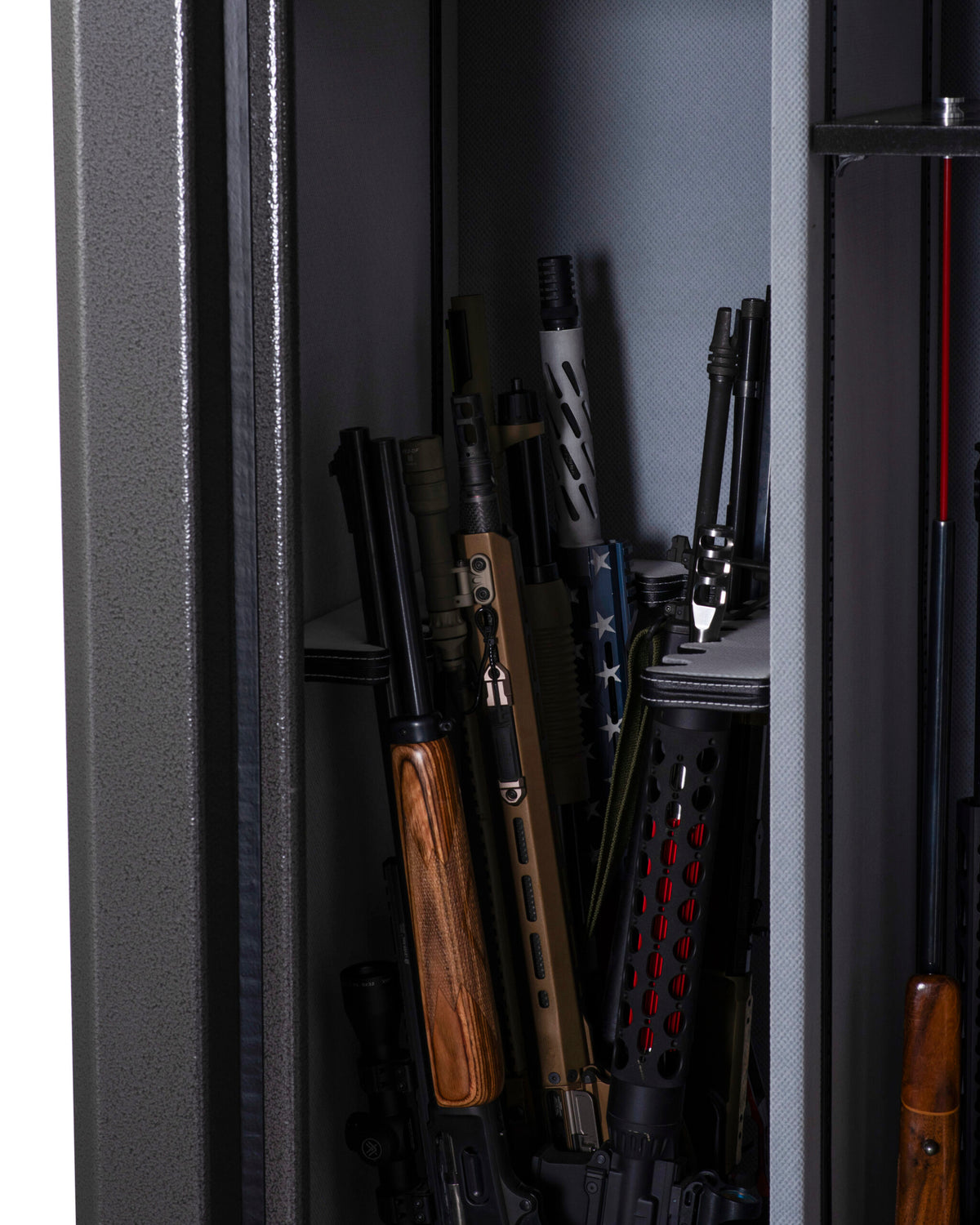 Winchester Big Daddy XLT interior side compartment with tactical rifles, an AR-style suppressor, and wood-stock long guns