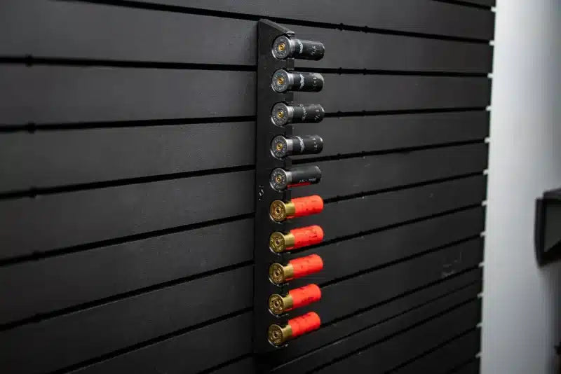 Set of shotgun shells on a black wall-mounted rack