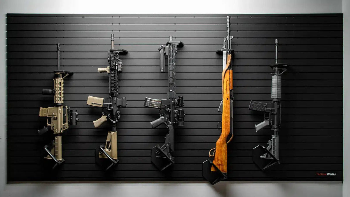 Five rifles mounted on a ModWall with a neutral background