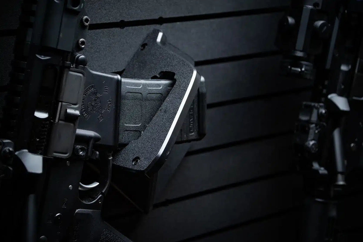Close-up of a black rifle magazine on a dark background