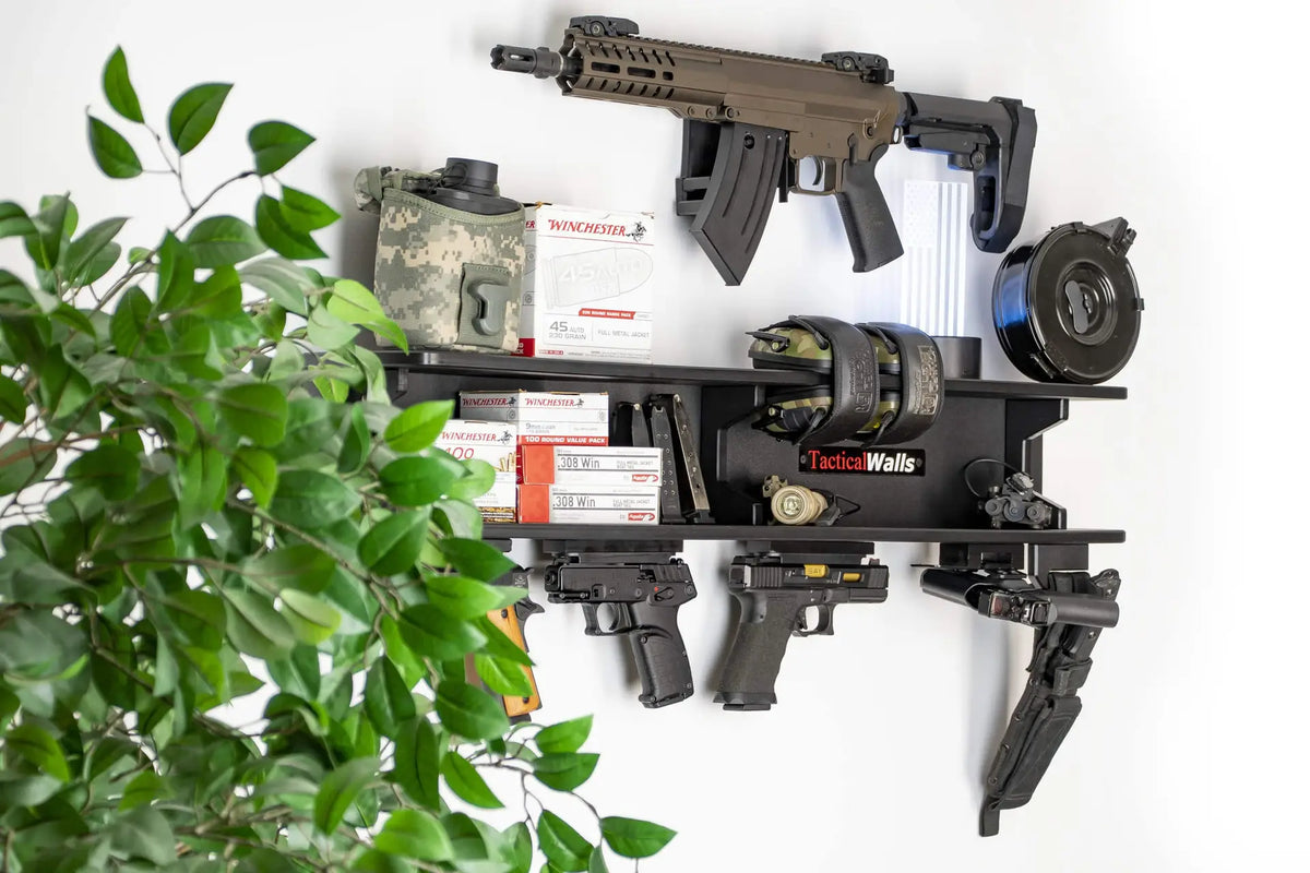Wall-mounted gun rack with firearms and ammunition on a white wall.
