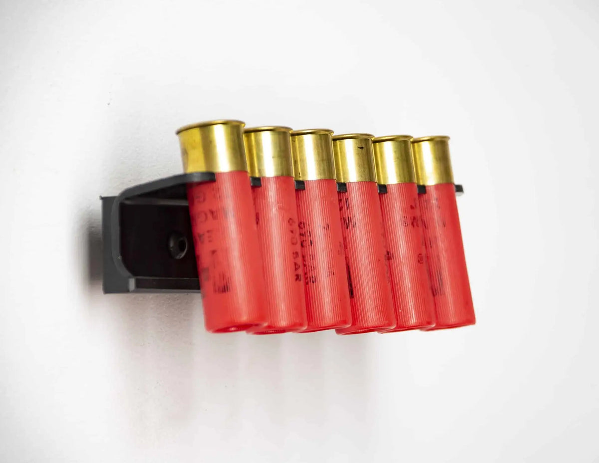 Red shotgun shells with gold caps on a white background