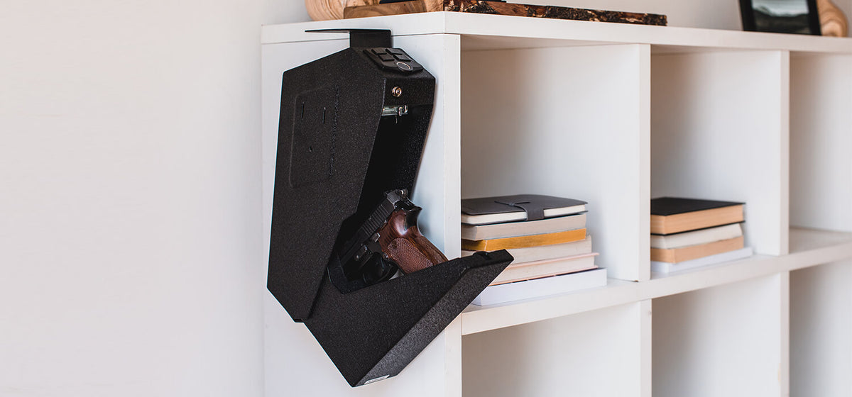 RPNB RP311F Fingerprint Handgun Safe with Quick Access Drop Down Lid Mounted on a Bookshelf
