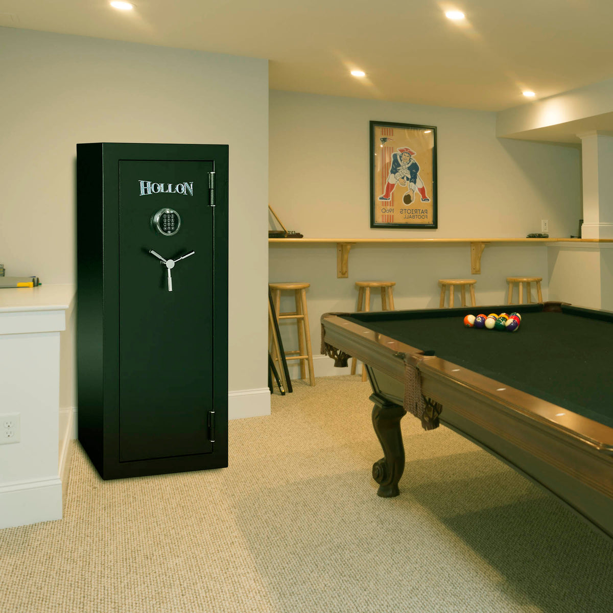 Hollon HGS-16E Hunter Series 16 gun safe installed in a finished basement game room next to a pool table