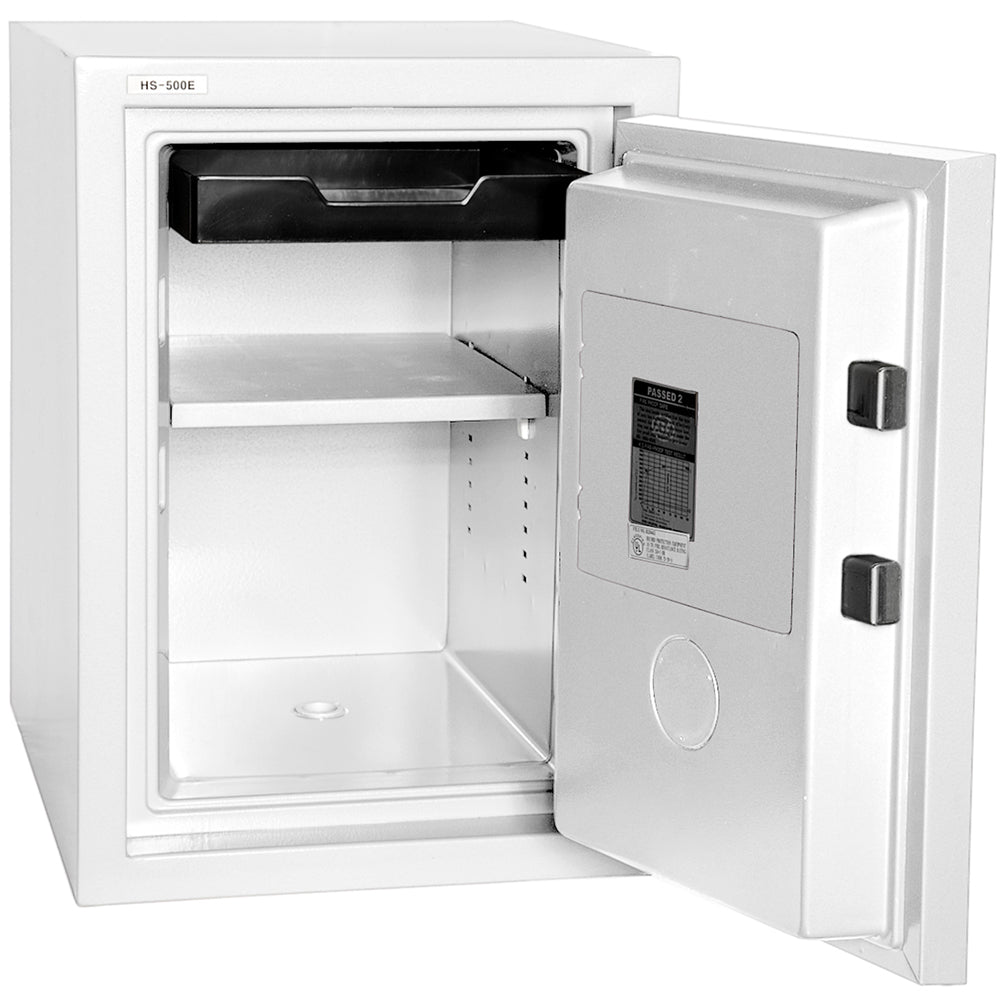 Hollon HS-500E fireproof home safe in white with door open showing tall upright interior with built-in top drawer, adjustable shelf, two square locking bolts on door edge, and Hollon fire test certification label on inside of door
