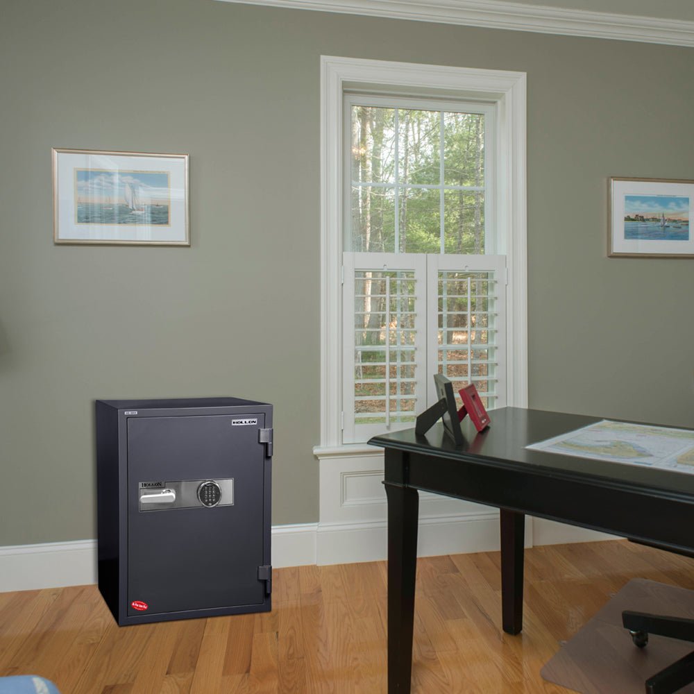Hollon 2-hour fireproof office safe installed against the wall in a home office setting, showing the upright cabinet form factor typical of Hollon's HS-series office safes

