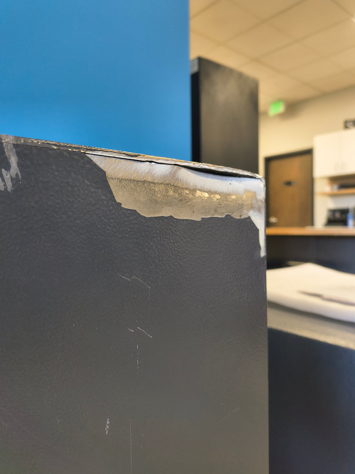 Blemished Protex FDD-3214 II damage to back top right corner of safe where the steel has split causing a potential security vulnerability. 