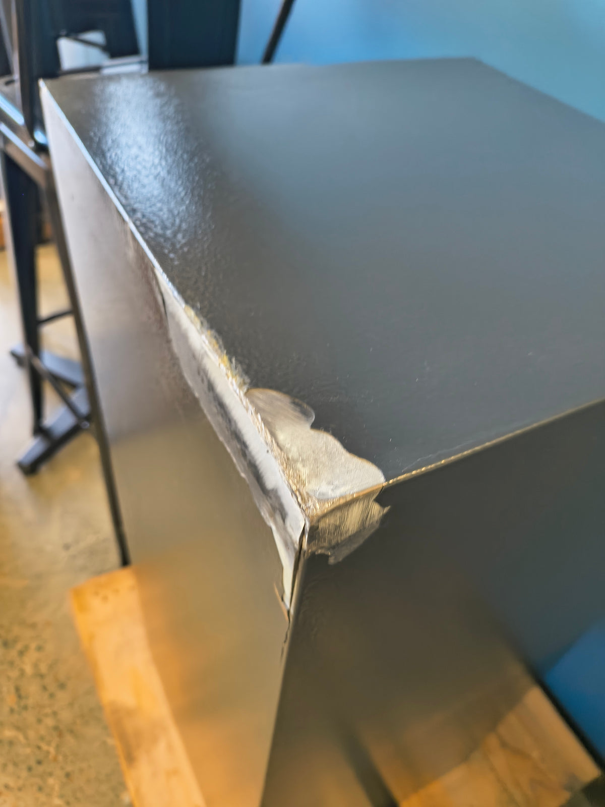 Blemished Protex FDD-3214 II damage to back top right corner of safe where the steel has split causing a potential security vulnerability. 