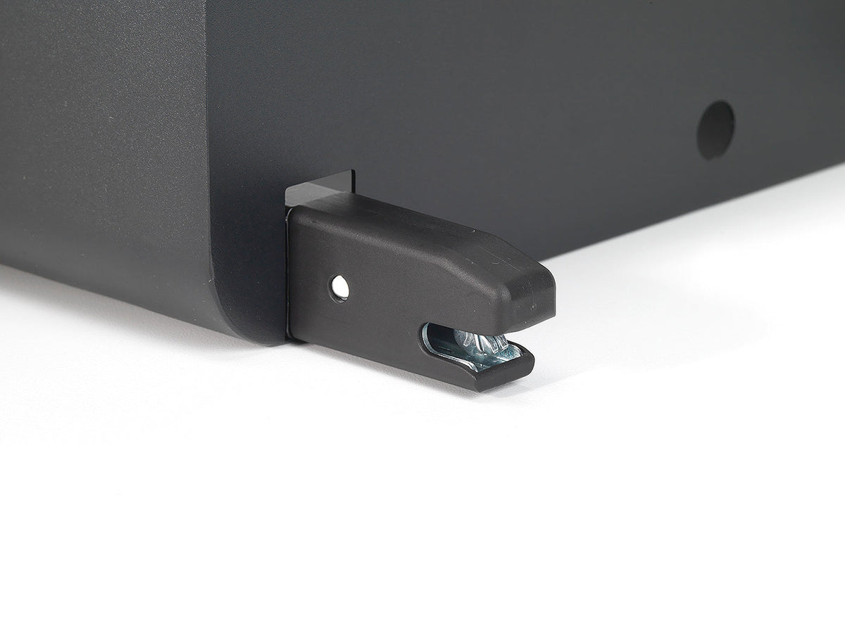 Close-up of a black metal bracket on a white background