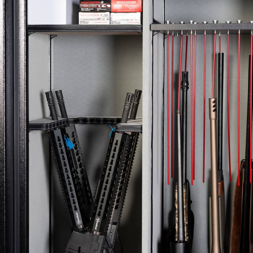 Close-up of the Winchester Legacy 62 interior with tactical AR-style rifles and wood-stock rifles in GunStiXX storage