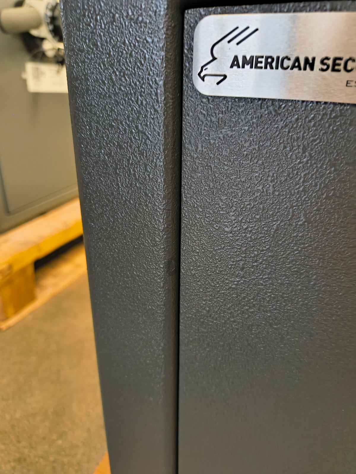 Blemished AMSEC MAX1014 TL-15 minor paint chip near door with touch up paint applied.