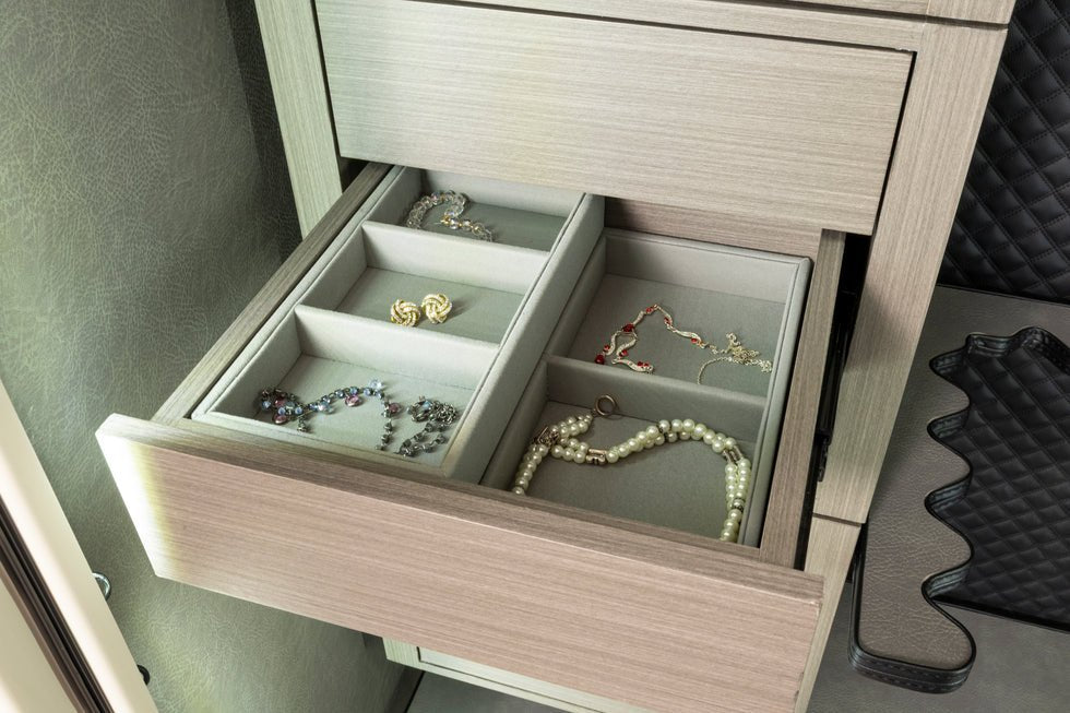 Liberty Pro Flex Jewelry Drawer installed inside a Liberty safe interior with the middle tray open showing rings and pearls