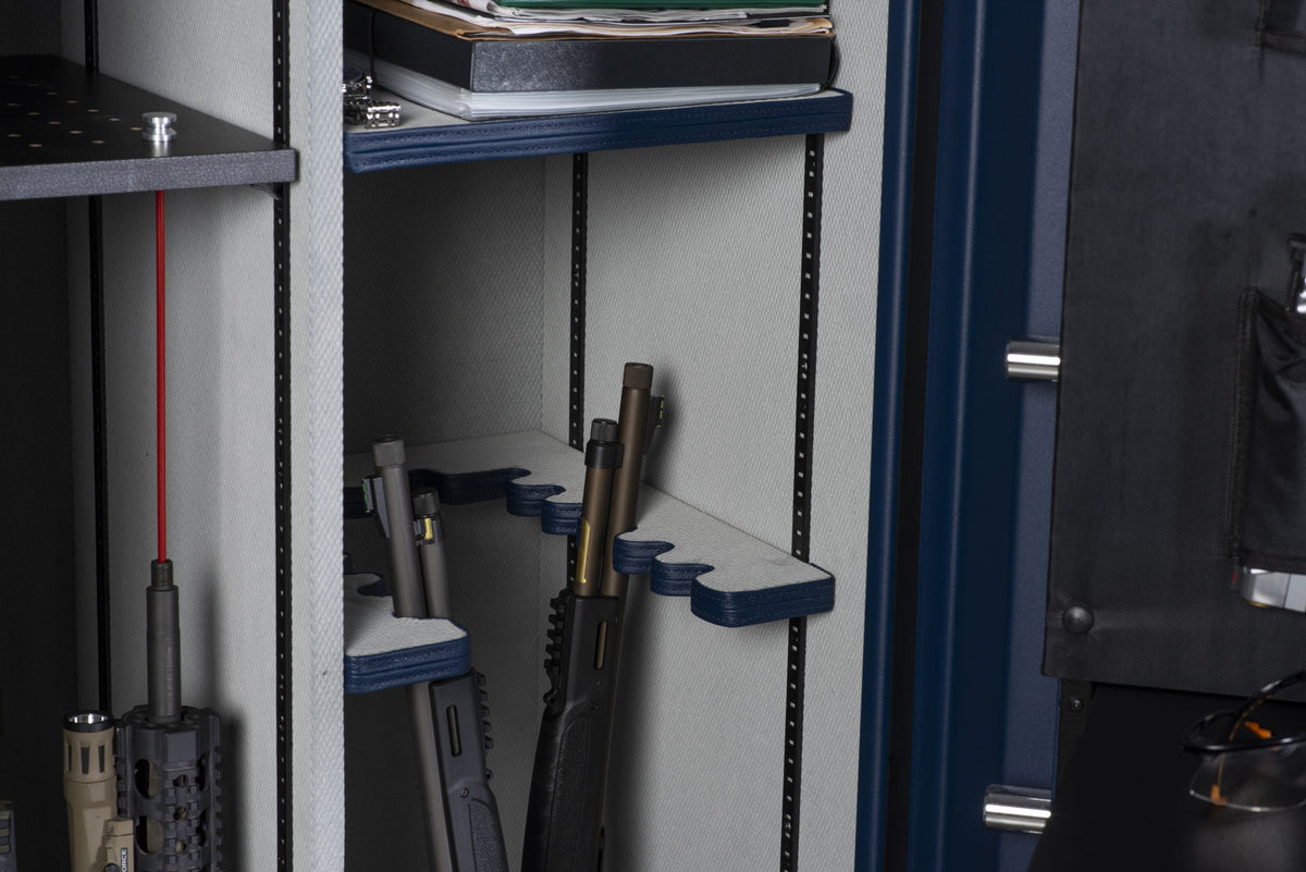 Close-up of the Winchester Outrider 25 U-shaped barrel rack with blue GunStiXX holders securing tactical rifles