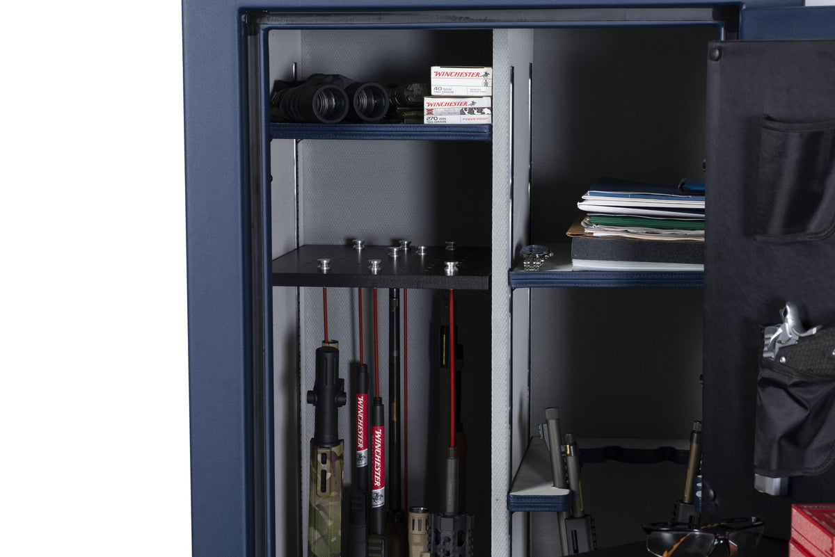 Upper shelf of the Winchester Outrider 25 with the GunStiXX plate holding rifle barrels alongside ammo and binoculars