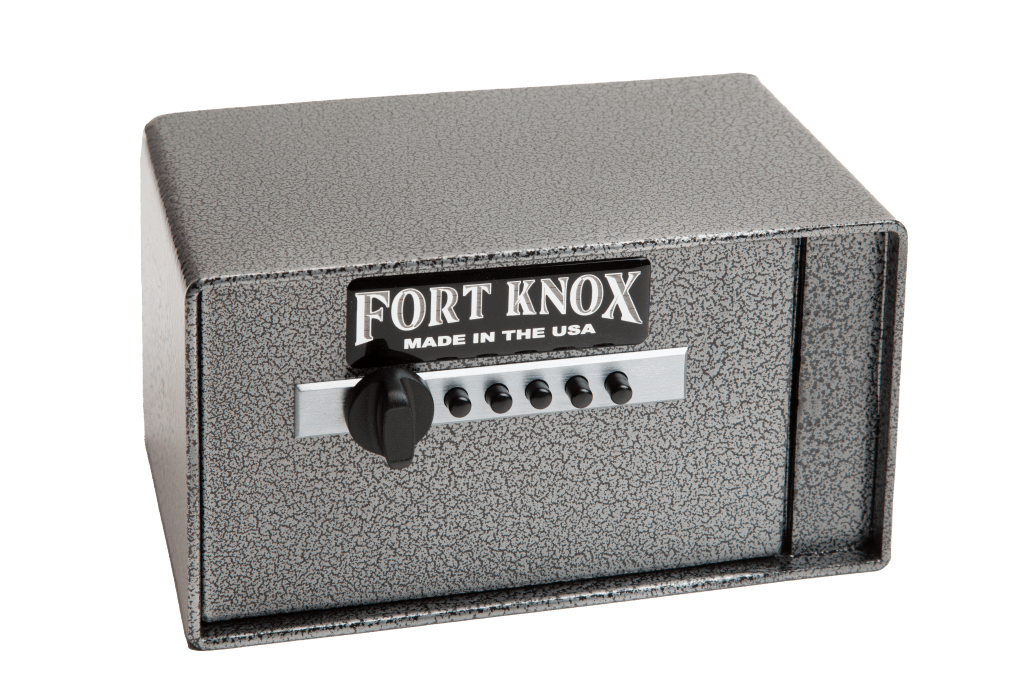 Fort Knox Auto Pistol Safe (FTK-Auto) shown from a front three-quarter angle in silver hammertone finish with a Simplex 5-button mechanical pushbutton lock and turn knob on the front-opening door, "FORT KNOX MADE IN THE USA" nameplate, compact rectangular tabletop pistol-box form factor with the door hinged on the right side