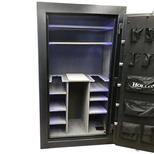 Hollon RG-42 Republic 42 gun safe gray interior close-up showing adjustable plush-lined shelving, gun rack divider, and blue LED motion lighting