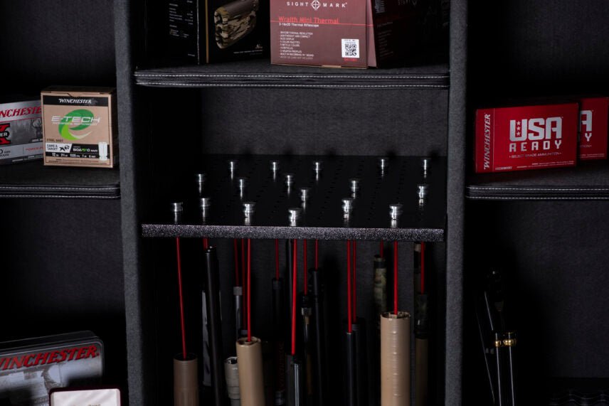 Close-up of the Winchester Ranger 66 GunStiXX vertical storage with red locking pins holding multiple long guns upright