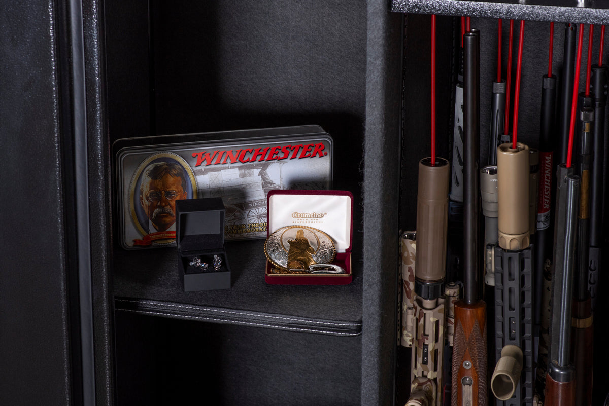 Winchester Ranger 66 interior with a Winchester Theodore Roosevelt tin and heirloom belt buckle staged next to long guns