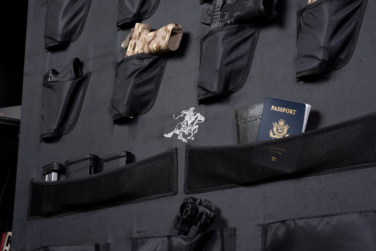Close-up of the Winchester Ranger 66 door organizer with handgun holsters, mag pockets, and a document pocket with passports