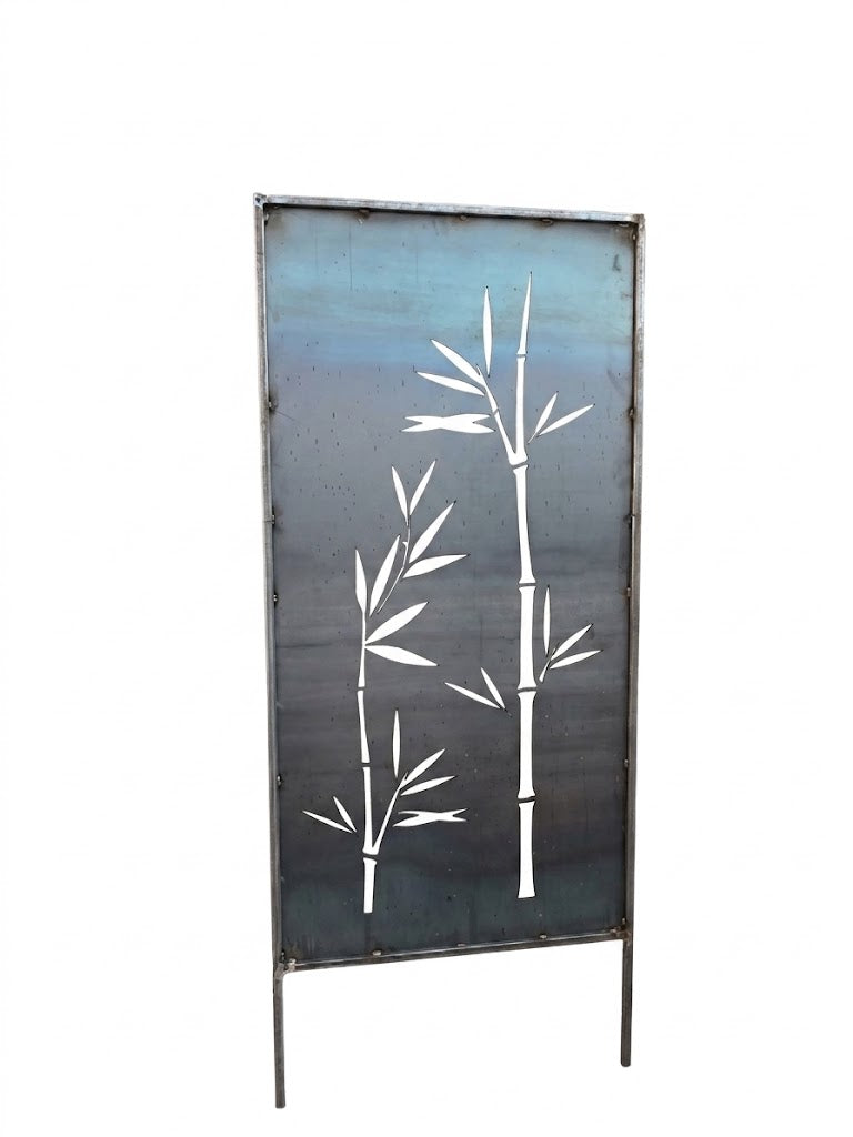 Ironman steel privacy screen freestanding outdoor garden panel in the Bamboo Silhouette design shown against a white background, featuring a full-height rectangular raw-steel panel with a minimalist three-stalk laser-cut bamboo cutout framed in tubular steel, with two integrated ground stakes at the base for staking into soil