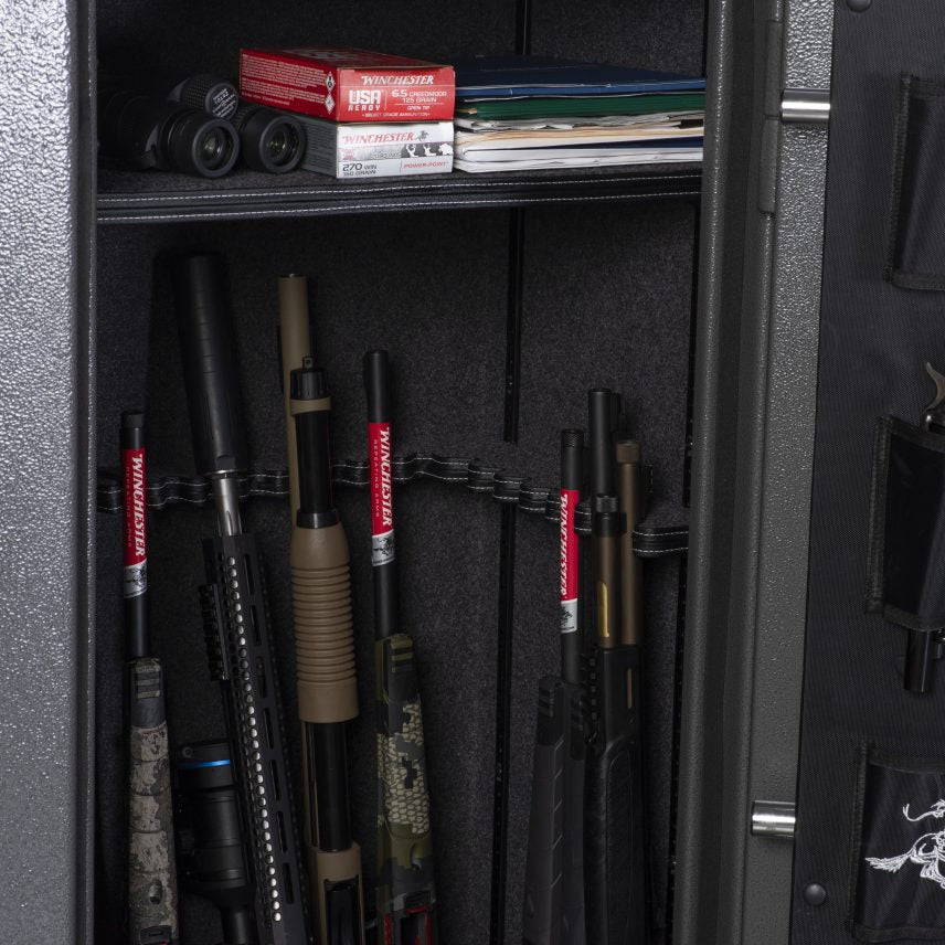 Winchester VaultLite 28 interior with Winchester-branded barrel rack holding long guns and ammo boxes on top shelf