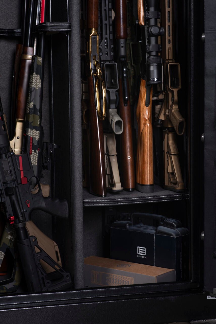 Winchester Bandit 14 gun safe styled on wood floor showing full slate finish and 3-spoke chrome vault handle presence