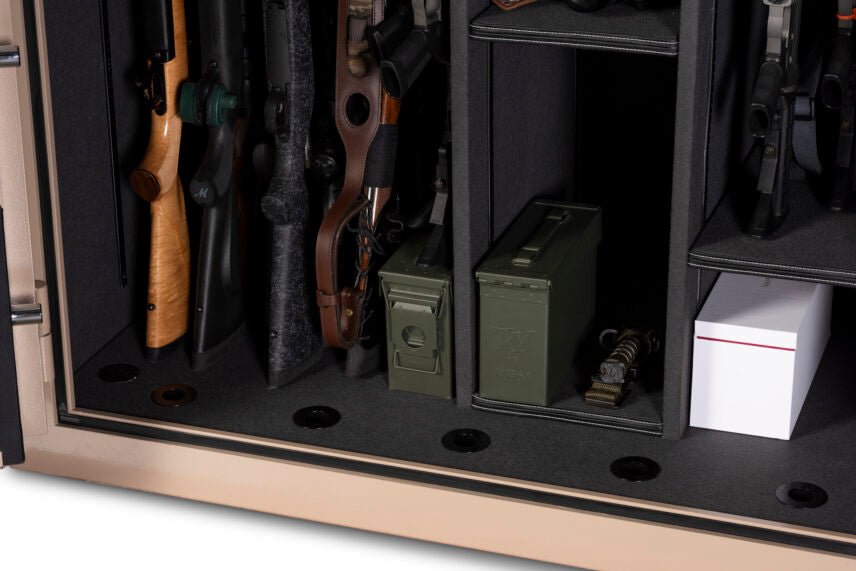 Interior close-up of the Winchester Grand American lower section with hunting rifles, military ammo cans, and ammo boxes