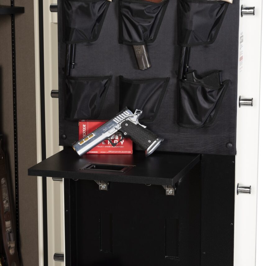Close-up of the Winchester Ranger 26 Americana retractable Utility Shelf extended with a 1911 handgun and Hornady ammo box on the shelf, the loaded door organizer above, and the Securam keypad below