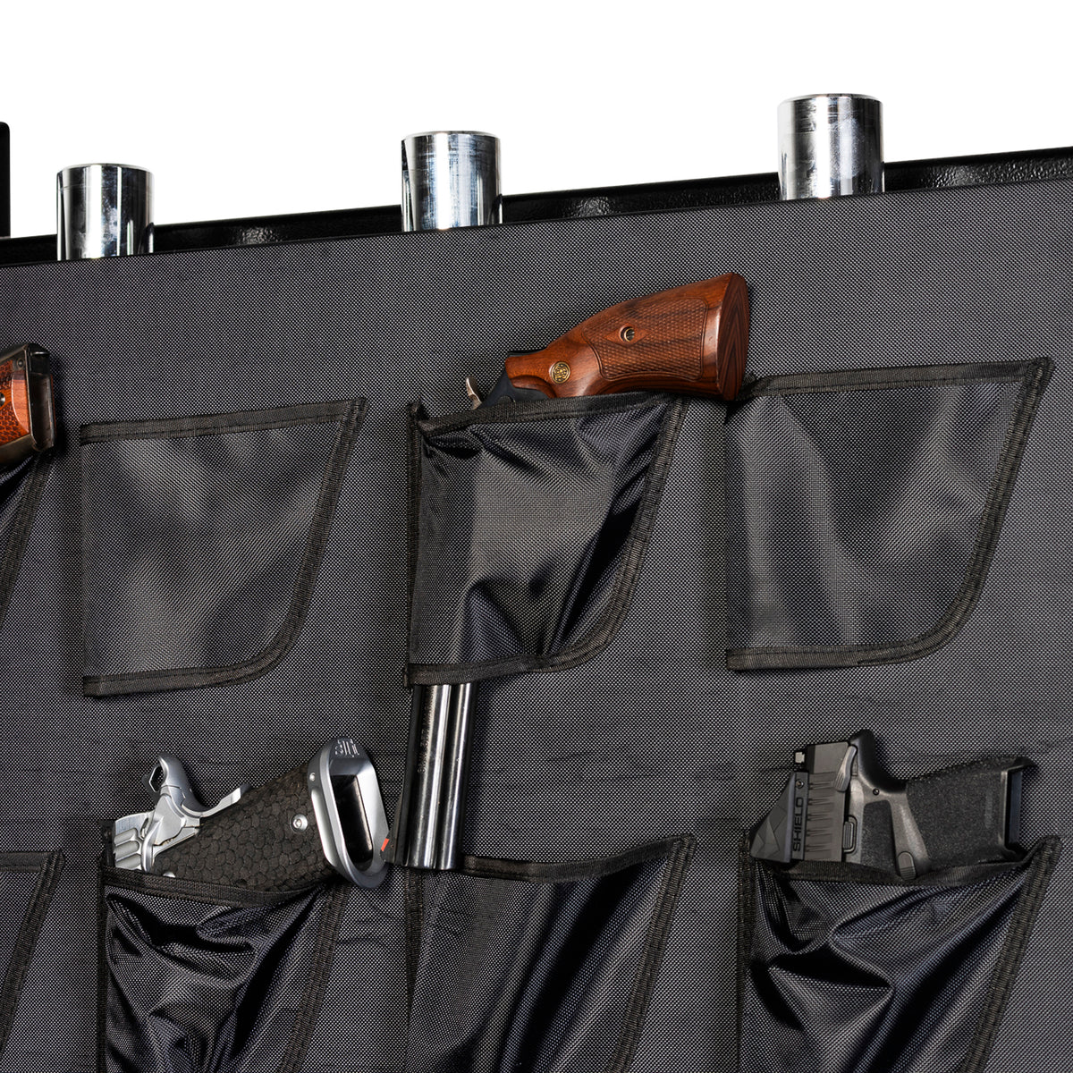 Close-up of the Winchester Legacy 53 door organizer with wood-grip revolvers holstered in the pockets