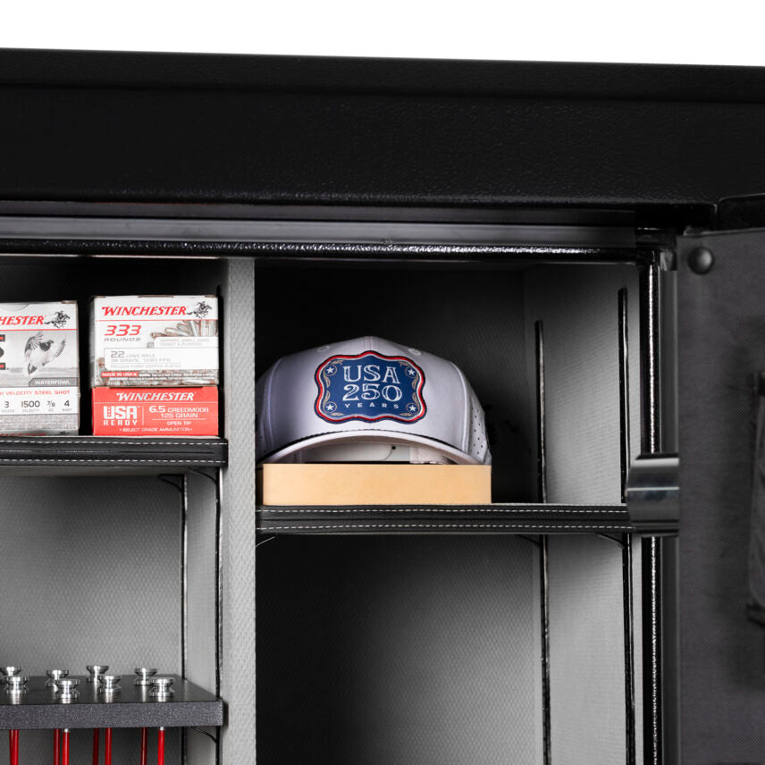 Winchester Legacy 53 interior with Winchester ammo boxes and a USA 250 commemorative cap staged on the shelves