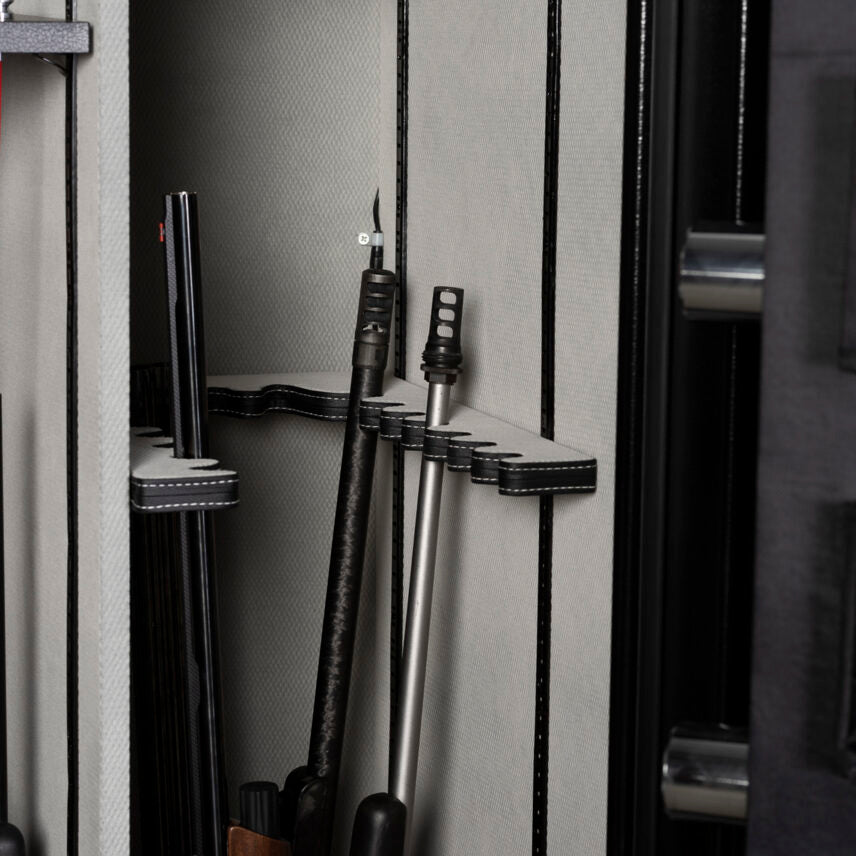 Close-up of the Winchester Legacy 53 U-shaped barrel rack cradling tactical rifles with muzzle brakes upright