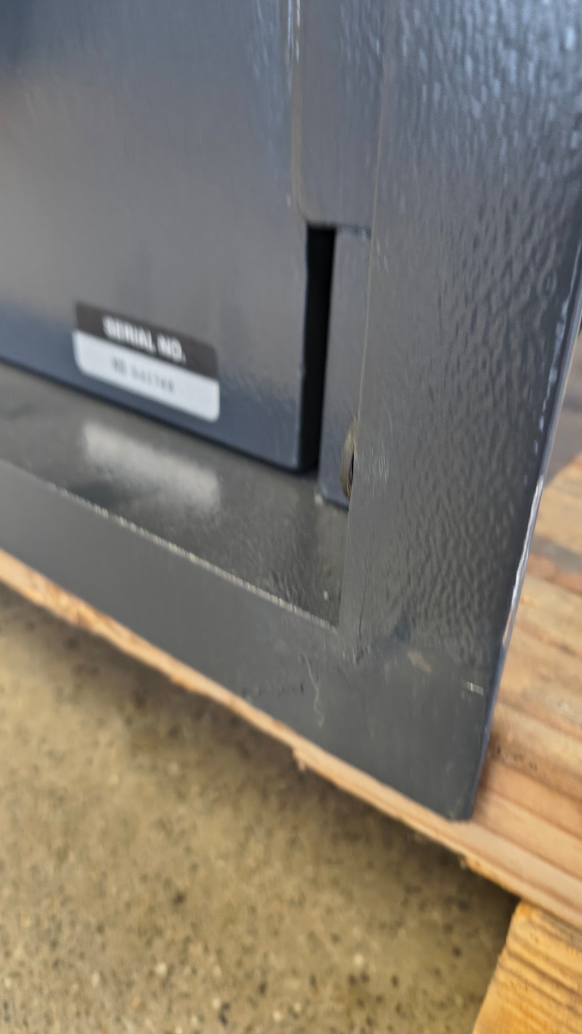 Blemished AMSEC WS1214E5 damage on bottom right corner of flange with touch up paint applied. 