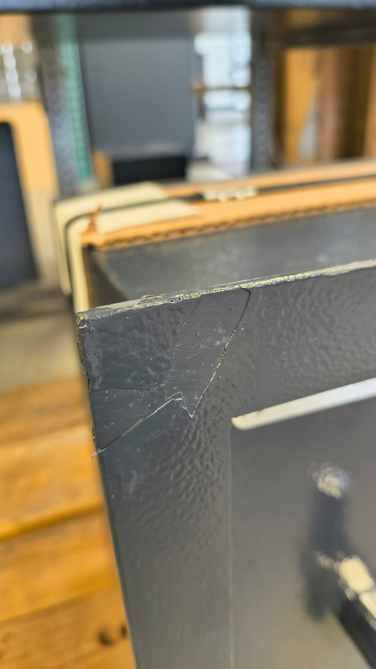 Blemished AMSEC WS1214E5 blemish on top left of flange with touch up paint applied. 