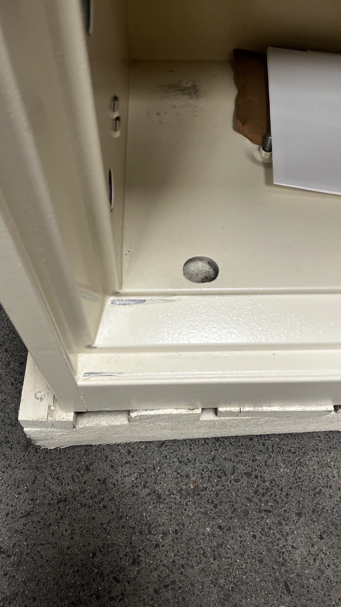 View of small scratches on the interior door trim. 