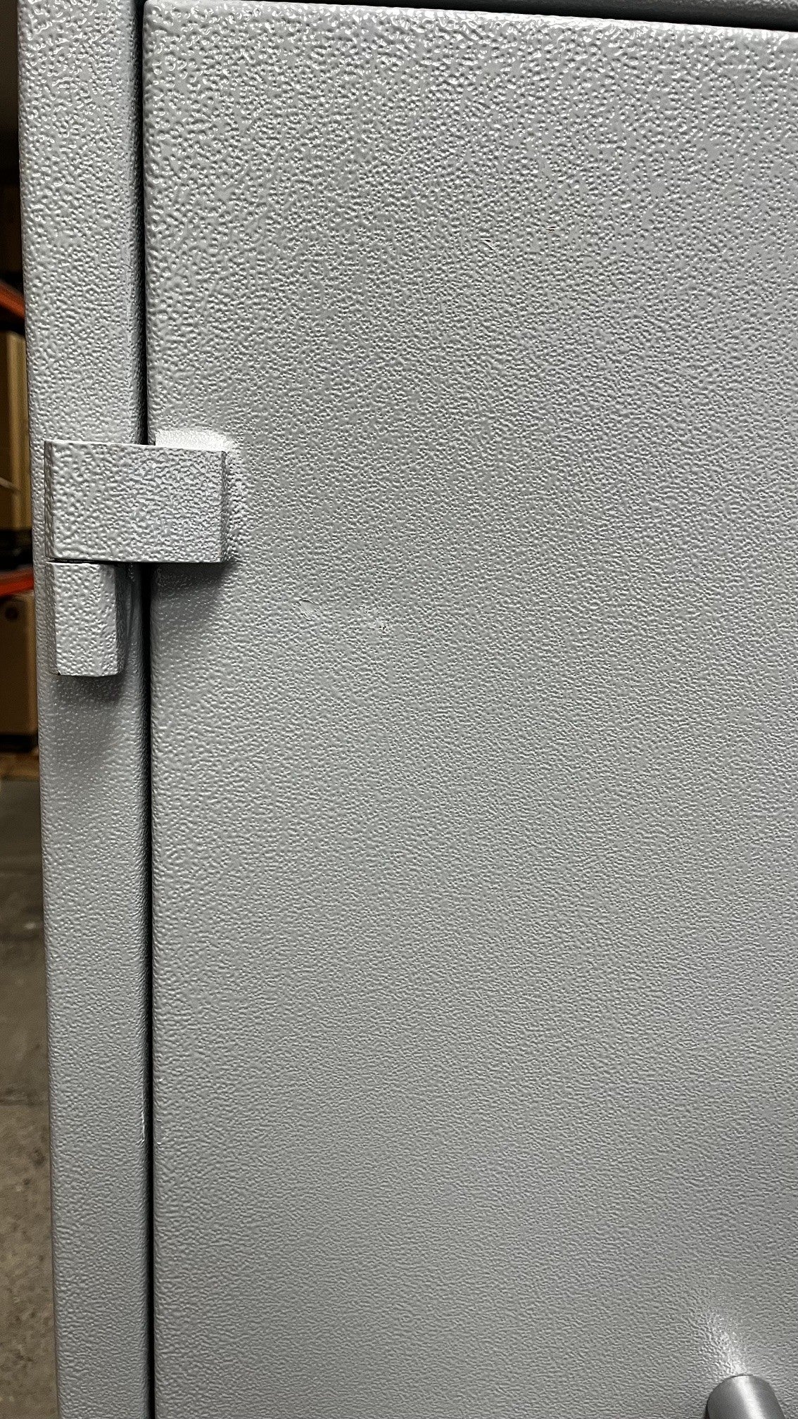The left door has a small dent on it. The dent has been painted over and pushed out to the best of our ability. 