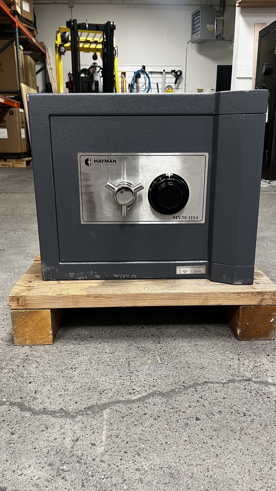 Front view of the safe, the safe has a few scratches alongside the bottom edge. 