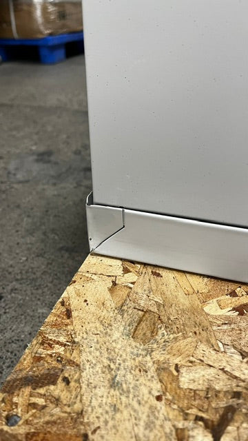 The lower back left corner has a small dent on the edge. 