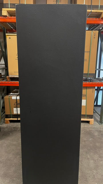 View of the left side of the safe. The top left corner and right corner both have a chip on the paint. 