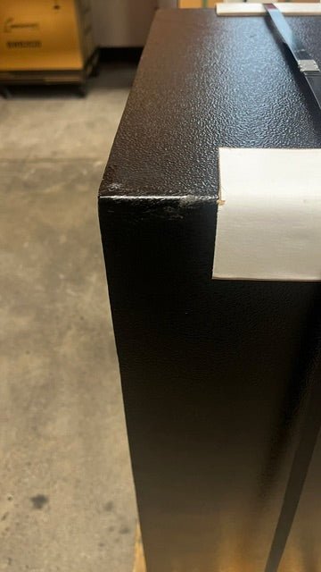 Paint chips on the top back left corner. 