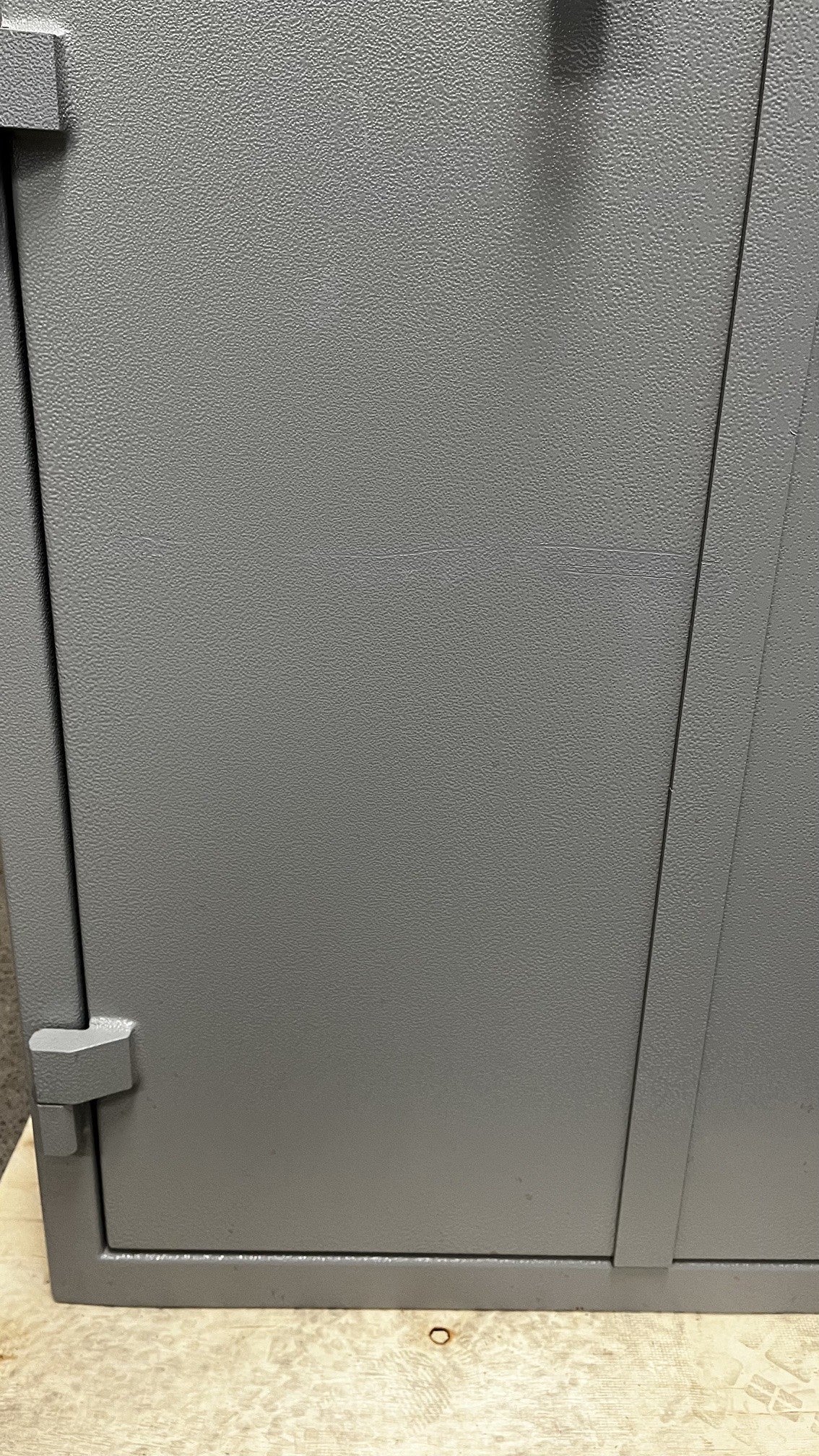 The front left door has a scratch; the scratch has need touched up with paint. 