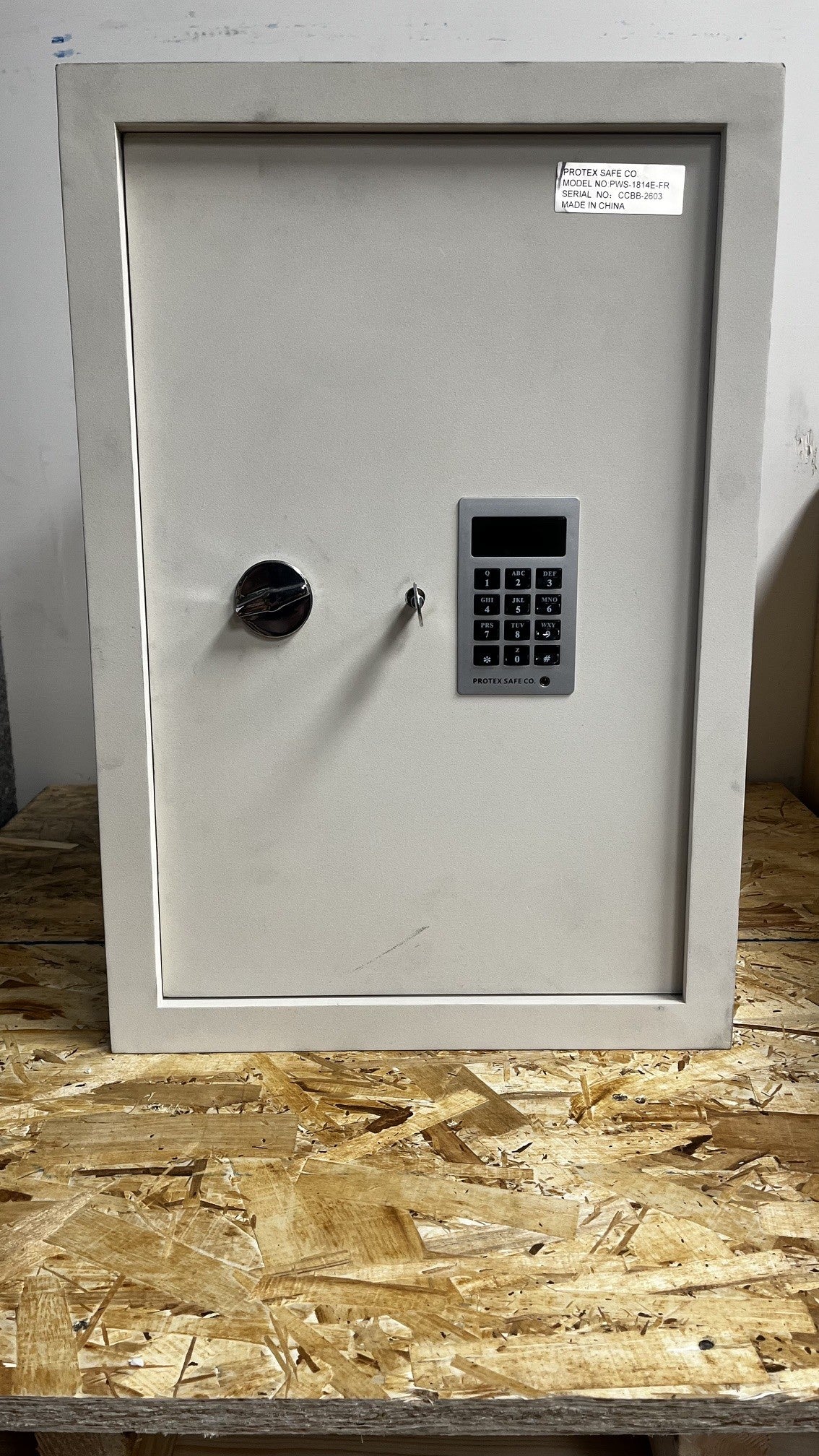 View of the front of the safe with the backup key access.