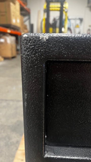 Close-up of the paint chip on the top left front side of the safe. 