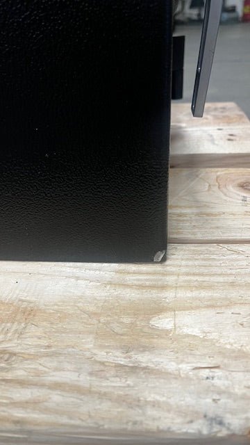 Close-up of the chip paint on the lower left side of the safe. 