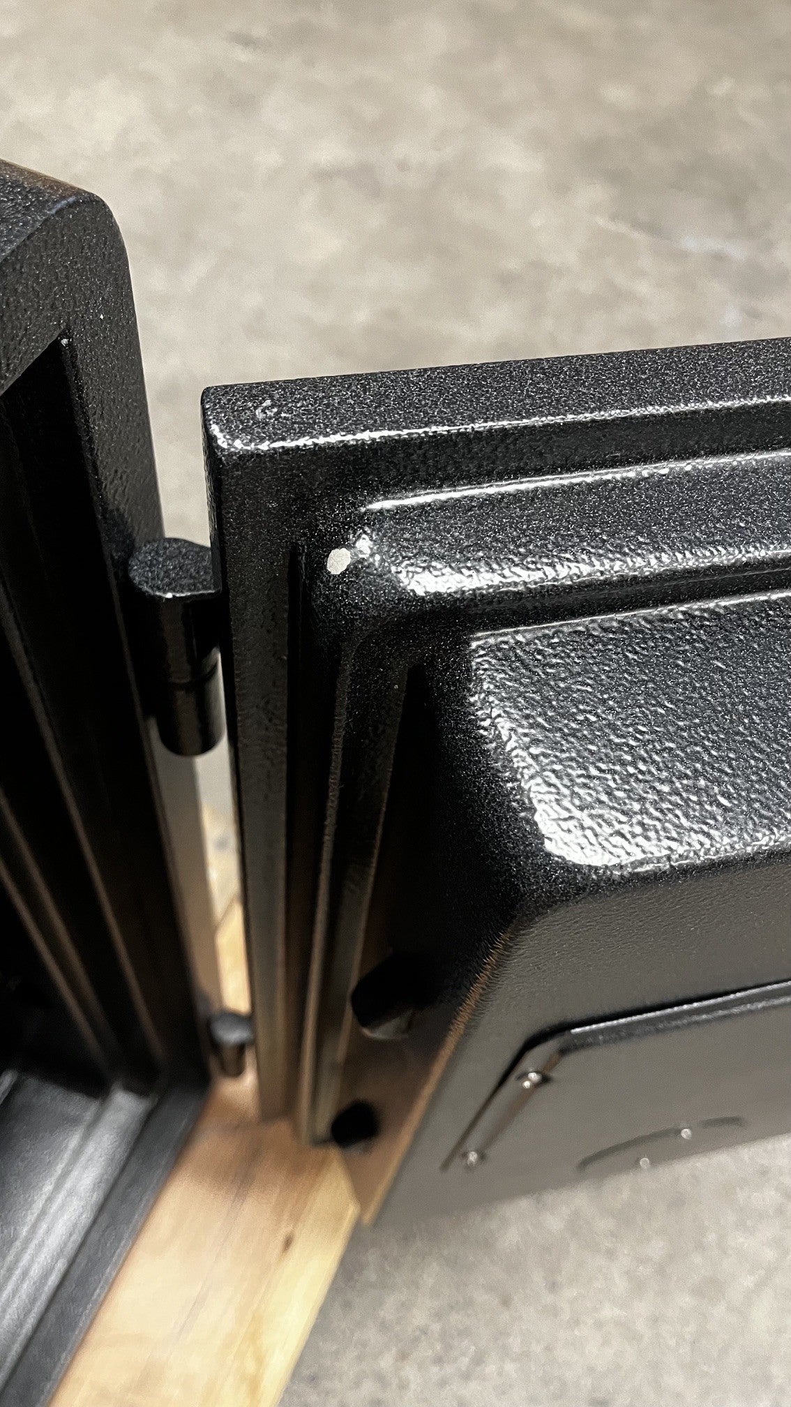 The inside of the door has a small paint chip on the corner. 
